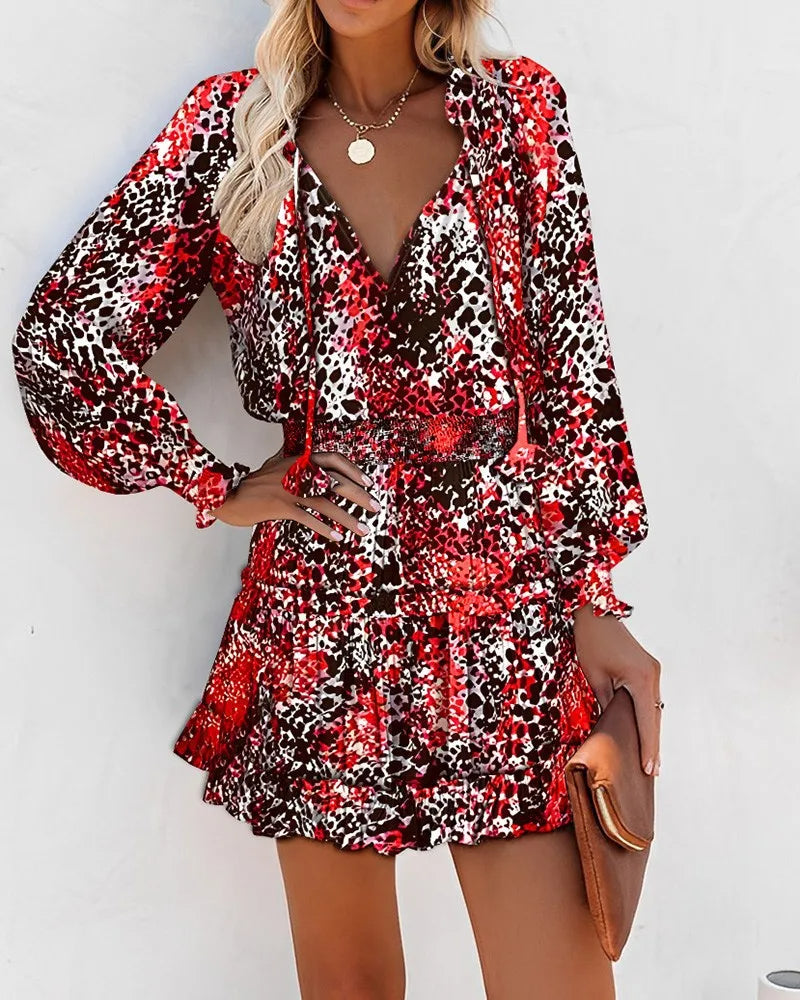 Flirty Floral Mini Patchwork Dress – Long Sleeve V-Neck Ruffle Waist for Springtime Charm